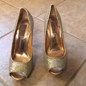 Gold peep toe pumps.